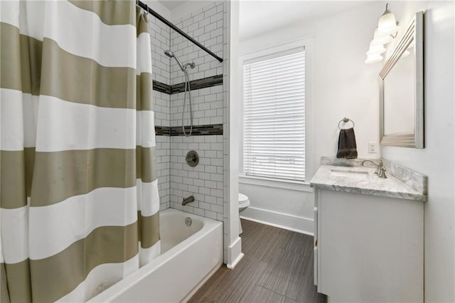 2728 Bienville St, New Orleans, LA 70119 - bathroom featuring toilet, vanity, baseboards, and shower / bath combo with shower curtain