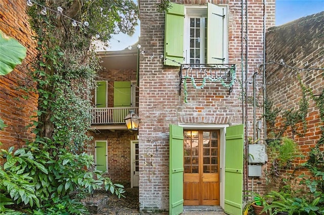 826 Bourbon St Unit B, New Orleans, LA 70116 - rear view of property featuring brick siding
