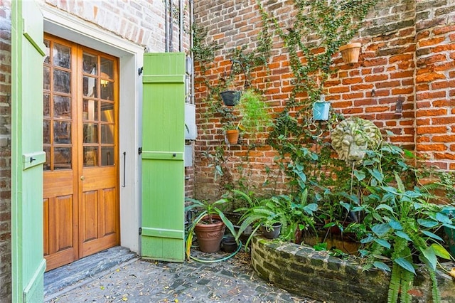 826 Bourbon St Unit B, New Orleans, LA 70116 - doorway to property featuring brick siding