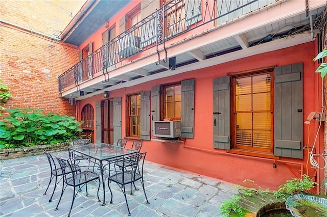 519 Madison St Unit C, New Orleans, LA 70116 - patio / terrace with a patio, outdoor dining space, and cooling unit