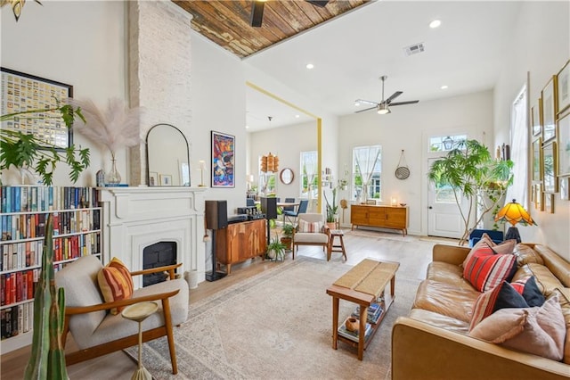 2712 Saint Thomas St, New Orleans, LA 70130 - living area with a ceiling fan, a large fireplace, recessed lighting, and light wood-style floors