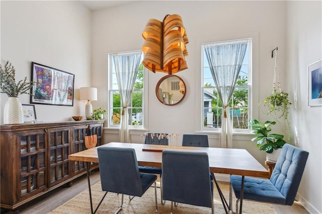 2712 Saint Thomas St, New Orleans, LA 70130 - dining area with wood finished floors and plenty of natural light