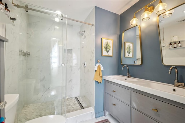 2712 Saint Thomas St, New Orleans, LA 70130 - bathroom featuring a marble finish shower and double vanity