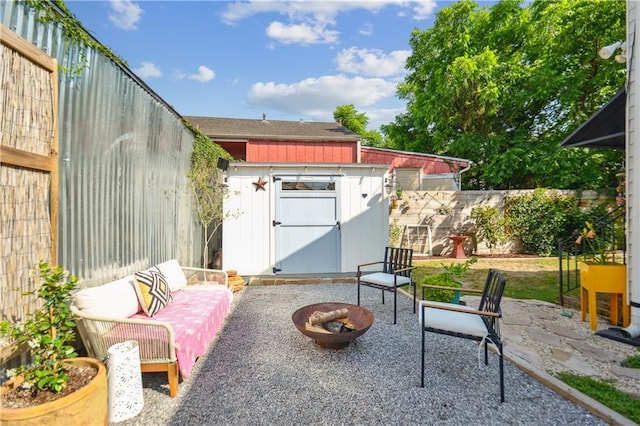 2712 Saint Thomas St, New Orleans, LA 70130 - view of patio featuring a shed, a fenced backyard, and an outbuilding