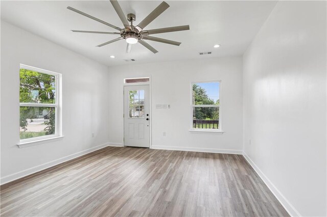 313331 Clouet St, New Orleans, LA 70126 - entrance foyer with healthy amount of natural light, wood finished floors, ceiling fan, baseboards, and recessed lighting