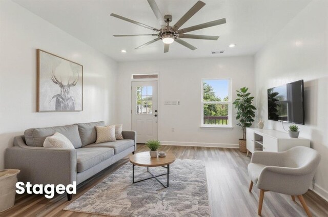 313331 Clouet St, New Orleans, LA 70126 - living area with wood finished floors, ceiling fan, baseboards, and recessed lighting