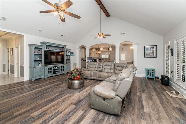 living room with ornate columns, a ceiling fan, wood finished floors, beam ceiling, and high vaulted ceiling