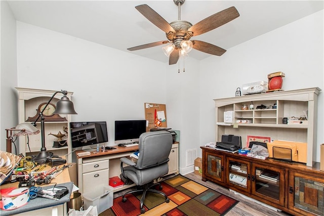 office featuring wood finished floors and a ceiling fan