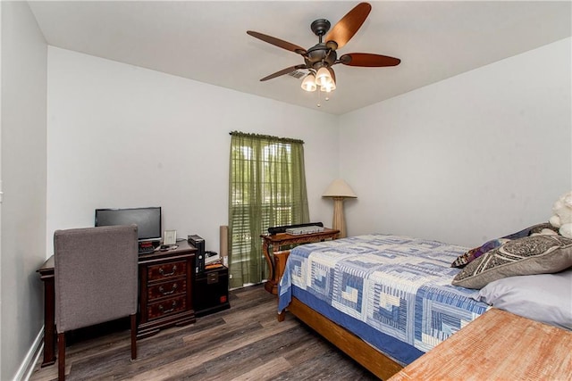bedroom with wood finished floors and a ceiling fan