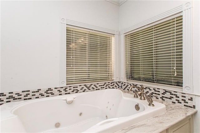 bathroom with a tub with jets
