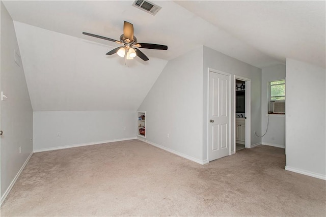 bonus room with carpet, vaulted ceiling, a ceiling fan, and baseboards