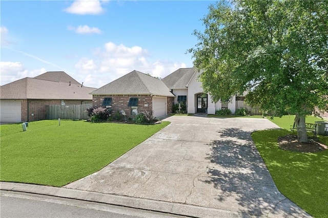 11446 Copperwood Dr, Denham Springs, LA 70726 - french country style house featuring driveway, a garage, and brick siding