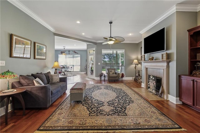 11446 Copperwood Dr, Denham Springs, LA 70726 - living area featuring ornamental molding, wood finished floors, a tile fireplace, recessed lighting, and ceiling fan