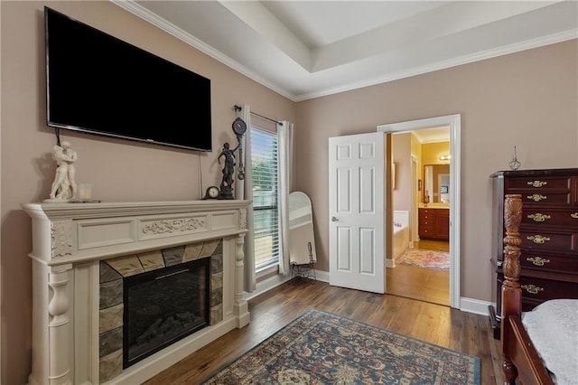 11446 Copperwood Dr, Denham Springs, LA 70726 - living area with wood finished floors, a fireplace, baseboards, and crown molding