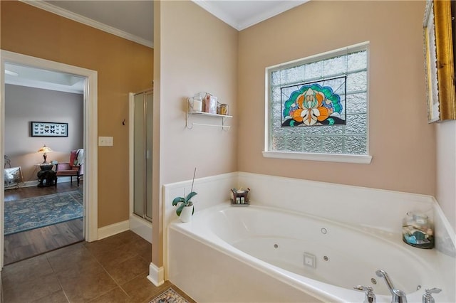 11446 Copperwood Dr, Denham Springs, LA 70726 - bathroom featuring a jetted tub, baseboards, tile patterned flooring, a shower stall, and ornamental molding