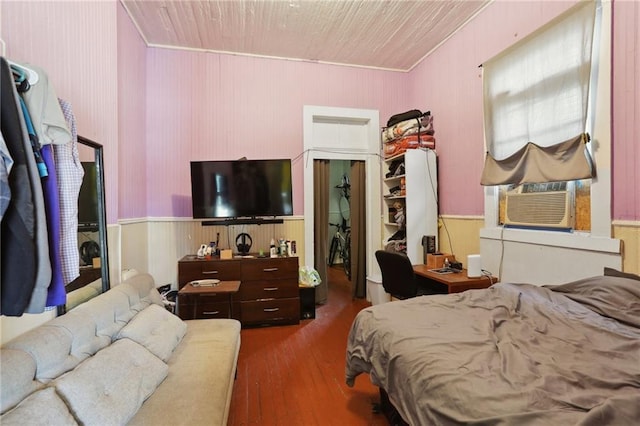 3979 S Front St, New Orleans, LA 70115 - bedroom featuring wood finished floors, ornamental molding, and wooden walls