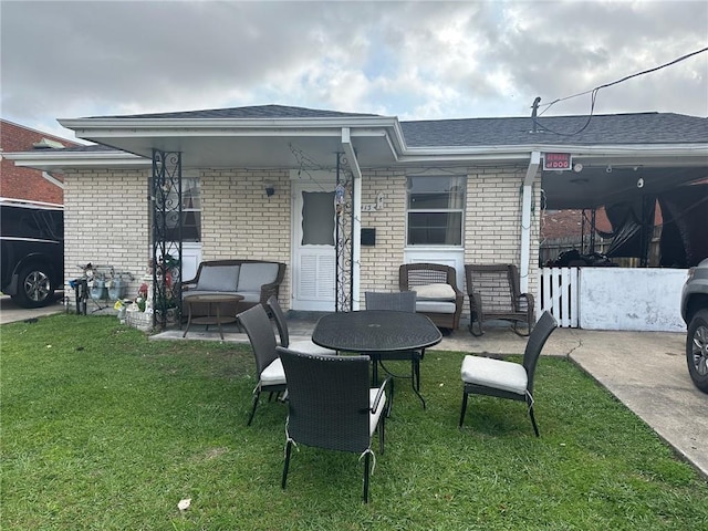 441315 Herrmann St, Metairie, LA 70006 - back of property featuring brick siding, a yard, and roof with shingles