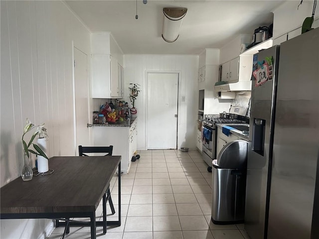 441315 Herrmann St, Metairie, LA 70006 - kitchen with appliances with stainless steel finishes, light tile patterned floors, and white cabinetry