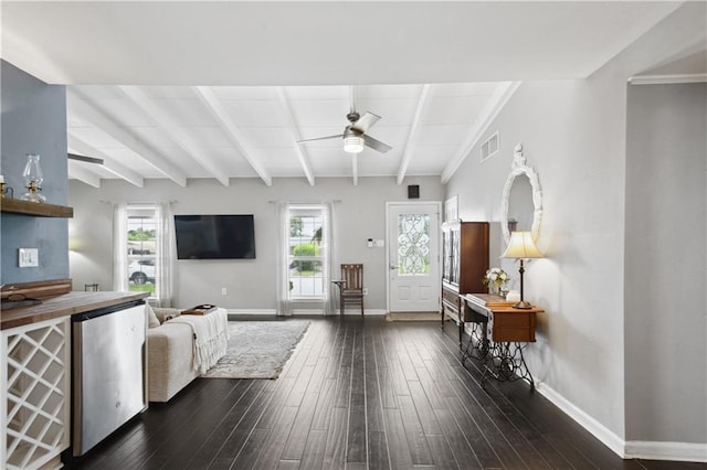 33 Caribou Ct, Metairie, LA 70003 - living area with ceiling fan, beam ceiling, dark wood finished floors, and baseboards