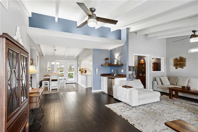 33 Caribou Ct, Metairie, LA 70003 - living room featuring beamed ceiling, a ceiling fan, dark wood finished floors, and baseboards