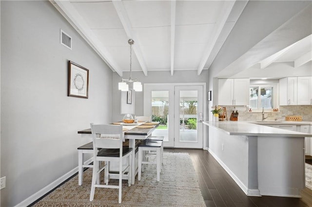33 Caribou Ct, Metairie, LA 70003 - dining space with dark wood-style flooring and baseboards