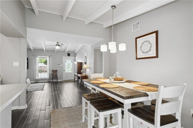 33 Caribou Ct, Metairie, LA 70003 - dining space with beamed ceiling, dark wood finished floors, ceiling fan, and baseboards