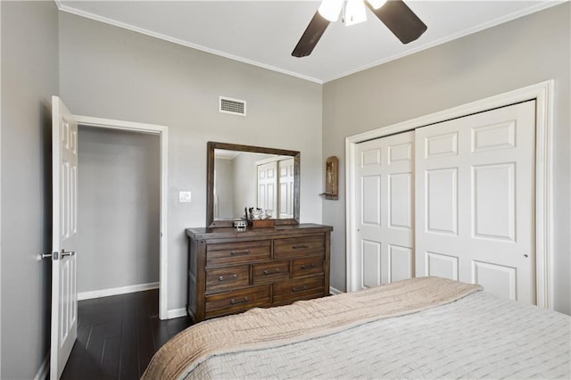 33 Caribou Ct, Metairie, LA 70003 - bedroom featuring baseboards, dark wood finished floors, ornamental molding, a closet, and ceiling fan