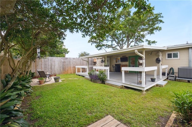 33 Caribou Ct, Metairie, LA 70003 - view of yard featuring central air condition unit and a wooden deck