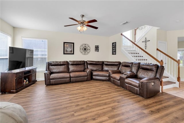 682 Amy Ct, Covington, LA 70433 - living area featuring stairway, a ceiling fan, wood finished floors, and baseboards