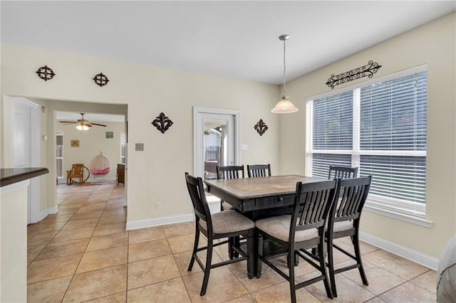 682 Amy Ct, Covington, LA 70433 - dining area with light tile patterned floors, baseboards, and ceiling fan