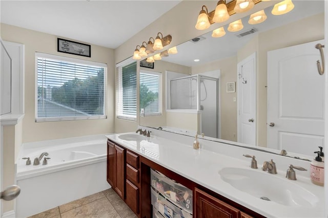 682 Amy Ct, Covington, LA 70433 - bathroom featuring a bath, a stall shower, double vanity, and tile patterned floors