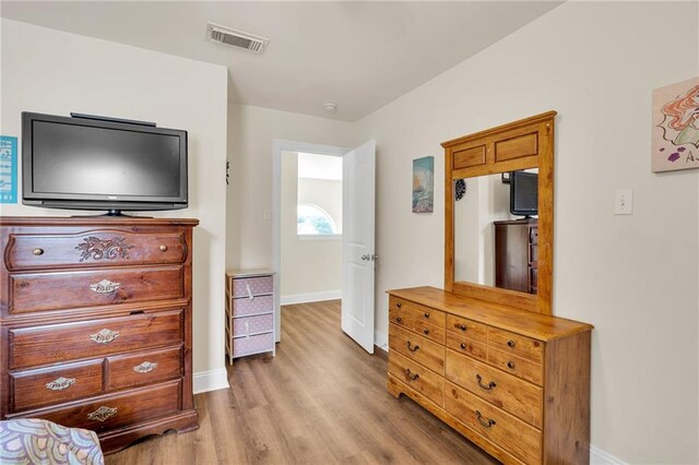 682 Amy Ct, Covington, LA 70433 - bedroom featuring wood finished floors and baseboards