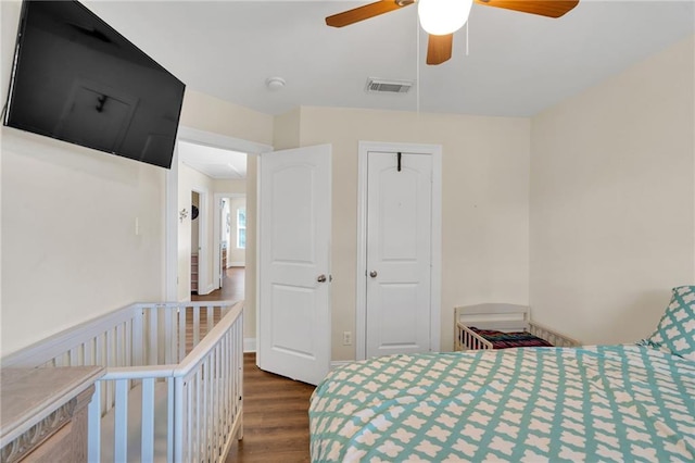 682 Amy Ct, Covington, LA 70433 - bedroom featuring dark wood-type flooring, ceiling fan, and a closet