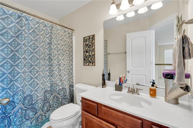 682 Amy Ct, Covington, LA 70433 - bathroom with toilet, vanity, and a shower with curtain
