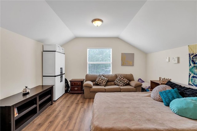 682 Amy Ct, Covington, LA 70433 - bedroom featuring wood finished floors and vaulted ceiling