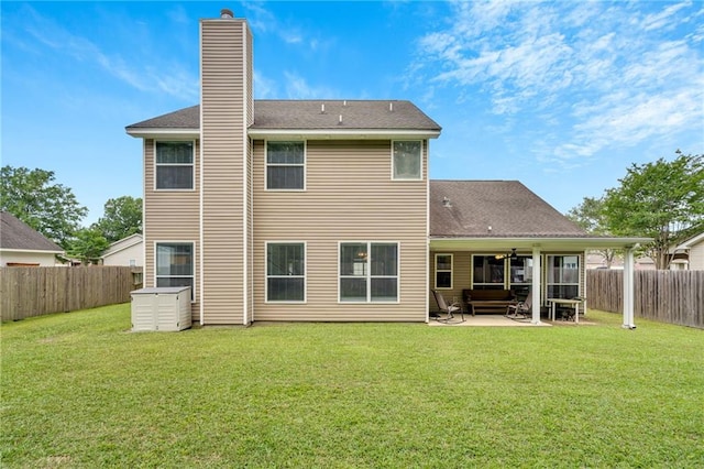682 Amy Ct, Covington, LA 70433 - rear view of house with a patio, a chimney, and a shingled roof