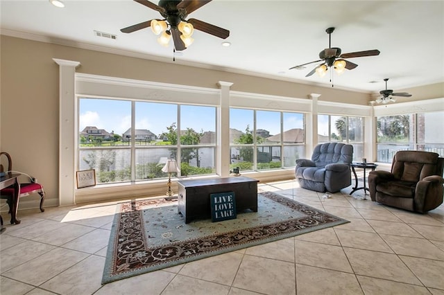 1681 Vela Cv, Slidell, LA 70458 - tiled living area with plenty of natural light, ceiling fan, crown molding, recessed lighting, and baseboards