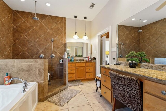 1681 Vela Cv, Slidell, LA 70458 - bathroom with a shower stall, vanity, a garden tub, and tile patterned floors