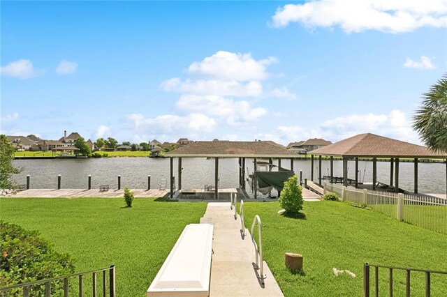 1681 Vela Cv, Slidell, LA 70458 - dock featuring boat lift, a water view, a lawn, and a residential view