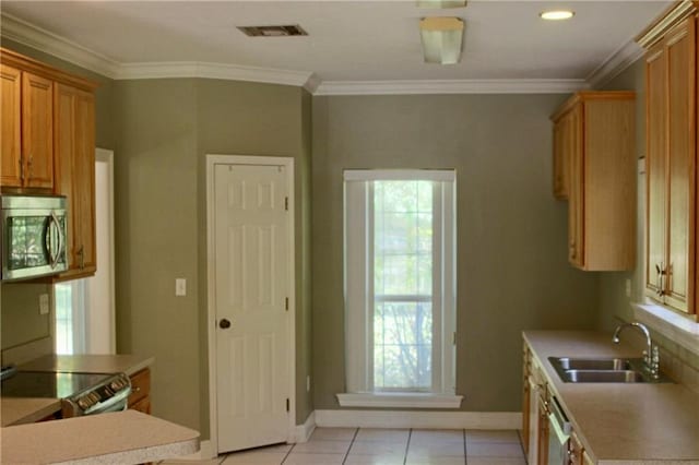 66165 Hickory Dr, Pearl River, LA 70452 - kitchen with appliances with stainless steel finishes, a sink, light countertops, baseboards, and ornamental molding