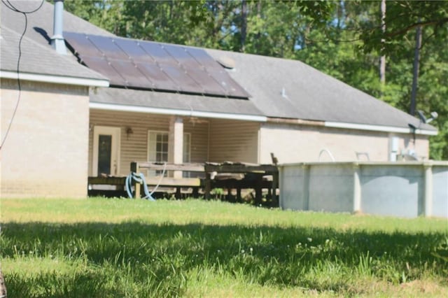 66165 Hickory Dr, Pearl River, LA 70452 - rear view of house with roof mounted solar panels