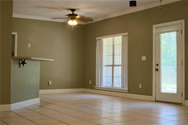 66165 Hickory Dr, Pearl River, LA 70452 - spare room with healthy amount of natural light, crown molding, a ceiling fan, and baseboards