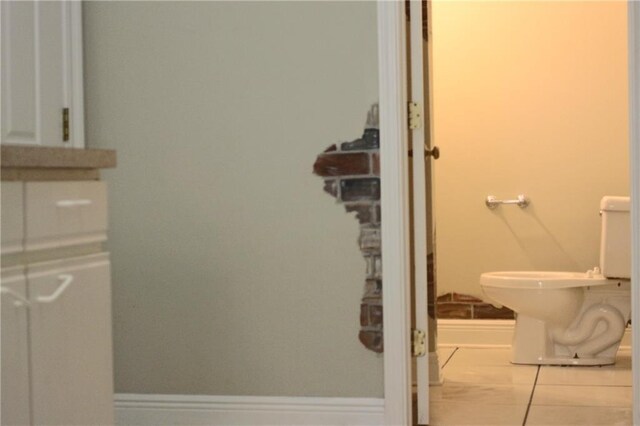 66165 Hickory Dr, Pearl River, LA 70452 - bathroom with tile patterned flooring, baseboards, and toilet