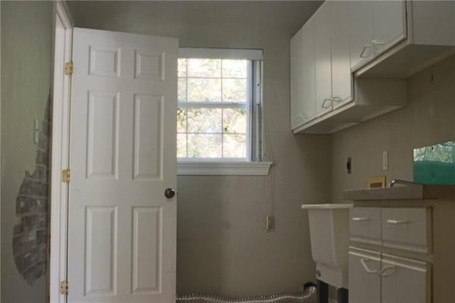 66165 Hickory Dr, Pearl River, LA 70452 - laundry room with hookup for a washing machine, electric dryer hookup, and cabinet space