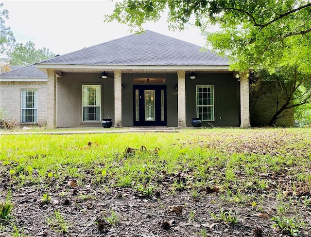 66165 Hickory Dr, Pearl River, LA 70452 - back of property with roof with shingles, stucco siding, and a ceiling fan