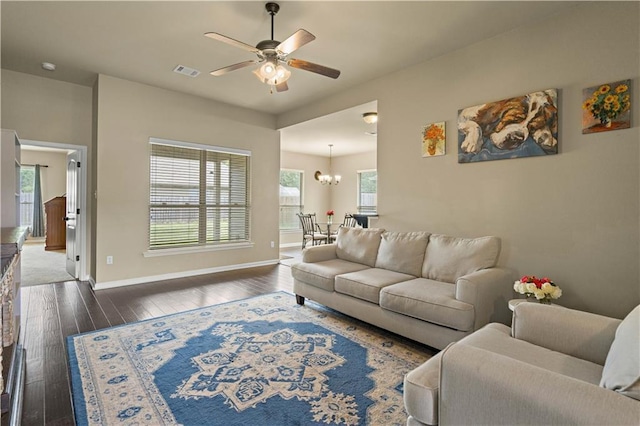 20413 Palm Blvd, Covington, LA 70435 - living room featuring wood-type flooring, a ceiling fan, a chandelier, and baseboards