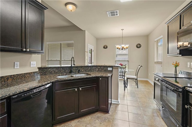 20413 Palm Blvd, Covington, LA 70435 - kitchen with black appliances, a sink, light tile patterned flooring, a chandelier, and a peninsula