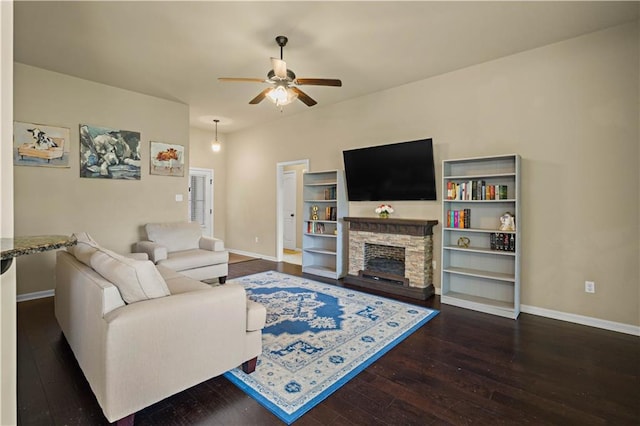 20413 Palm Blvd, Covington, LA 70435 - living area featuring dark wood finished floors, baseboards, and ceiling fan