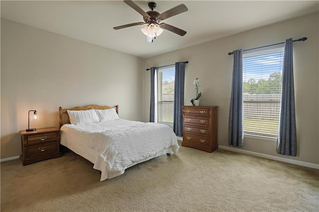 20413 Palm Blvd, Covington, LA 70435 - bedroom with baseboards, light carpet, and a ceiling fan
