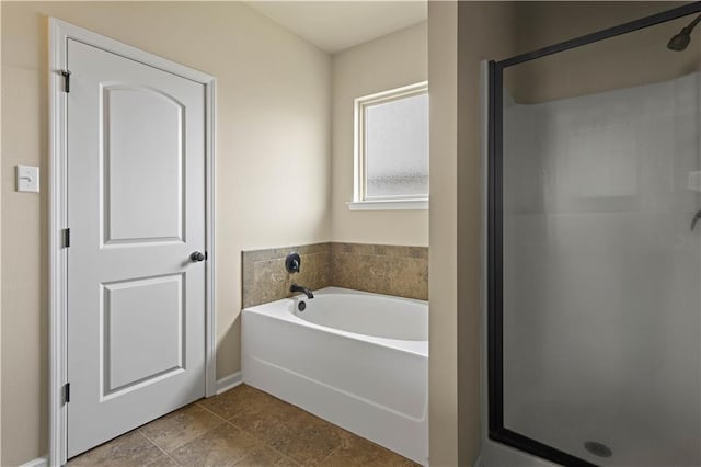20413 Palm Blvd, Covington, LA 70435 - full bathroom featuring a shower stall, a bath, and baseboards
